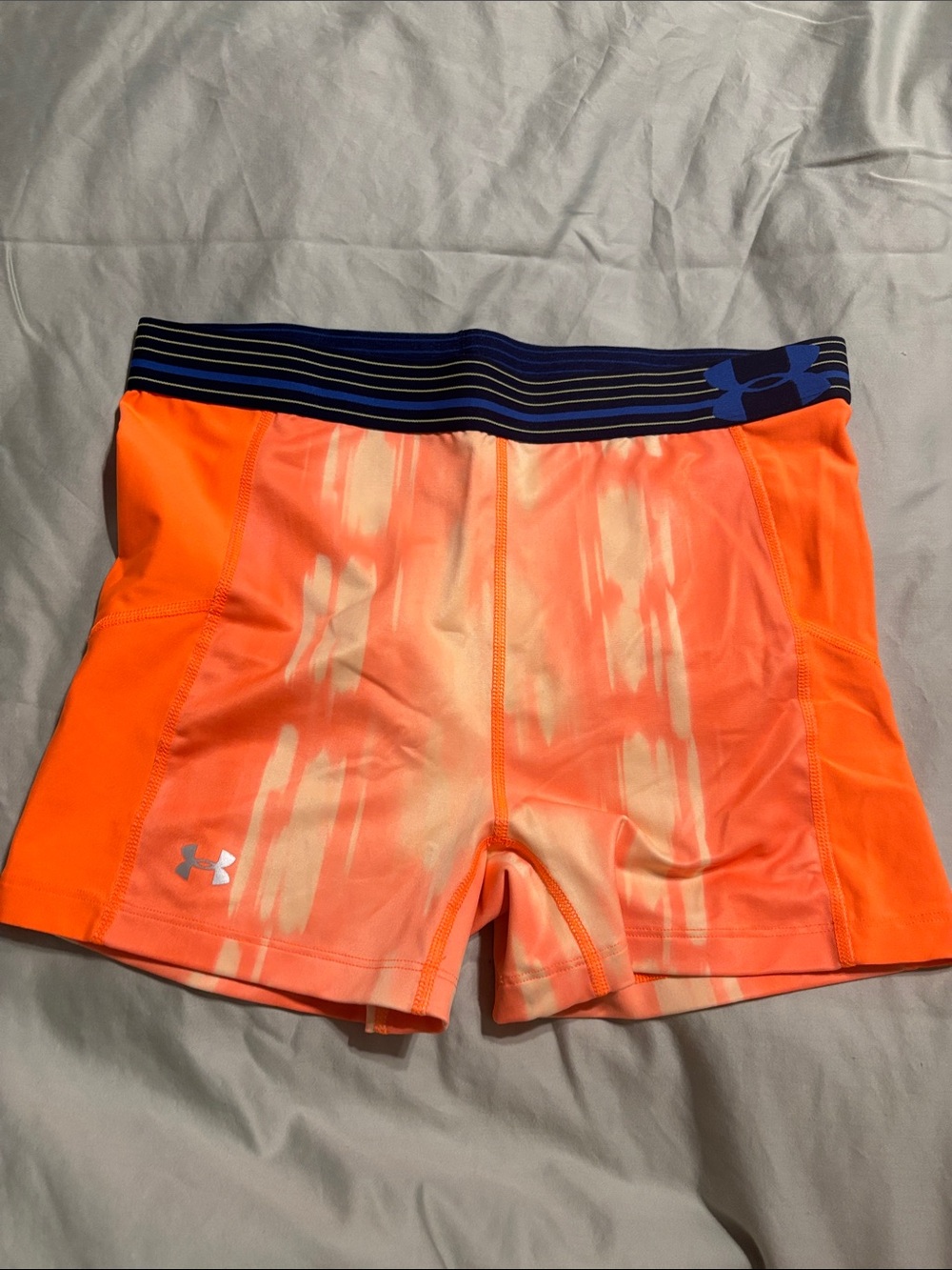 Under Armour Women's Neon Orange Performance Bike Shorts with Navy Waistband
